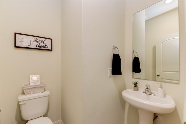 bathroom featuring sink and toilet