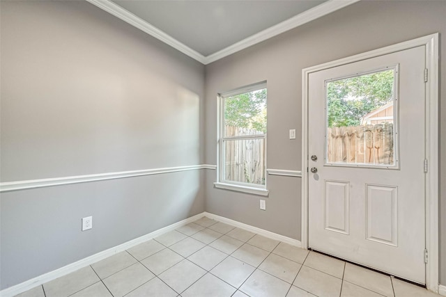 entryway featuring crown molding, a healthy amount of sunlight, and light tile patterned floors