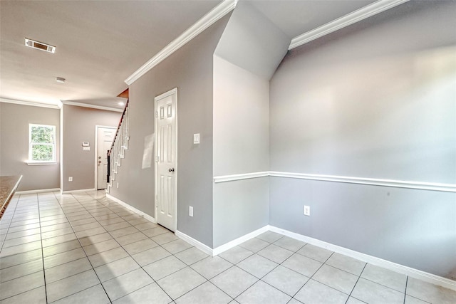 interior space featuring crown molding and light tile patterned floors