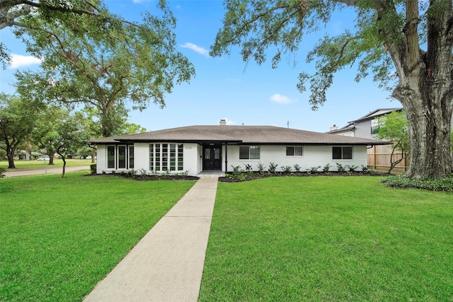 ranch-style home with a front yard