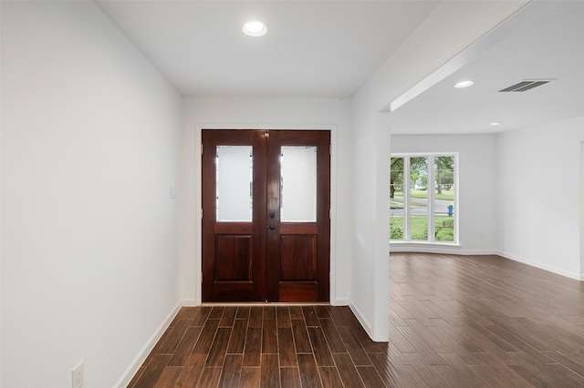 foyer featuring dark hardwood / wood-style flooring and french doors