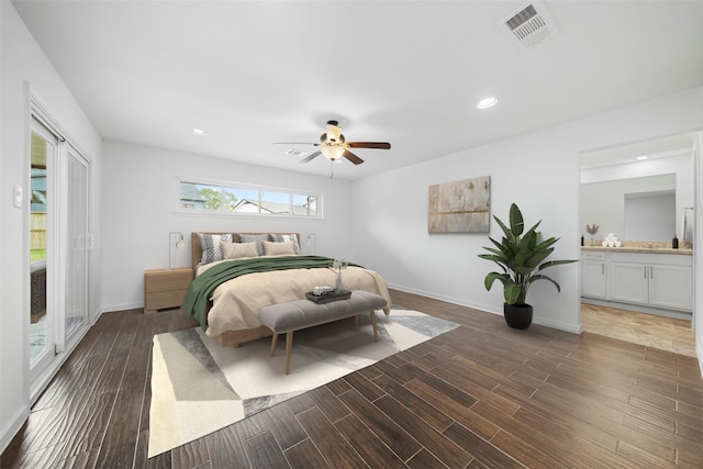 bedroom with ceiling fan, connected bathroom, and dark hardwood / wood-style floors