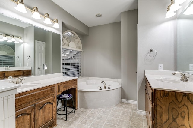 bathroom with vanity and a bathing tub