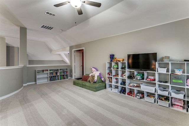 rec room featuring carpet floors, ceiling fan, and vaulted ceiling