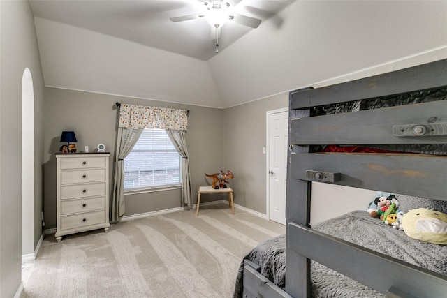 carpeted bedroom featuring ceiling fan and vaulted ceiling