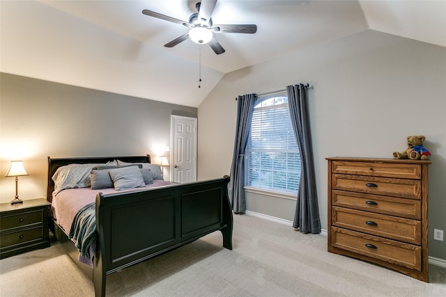 bedroom with lofted ceiling, light carpet, and ceiling fan