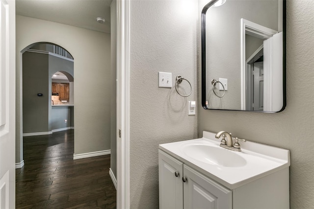 bathroom with vanity and hardwood / wood-style flooring