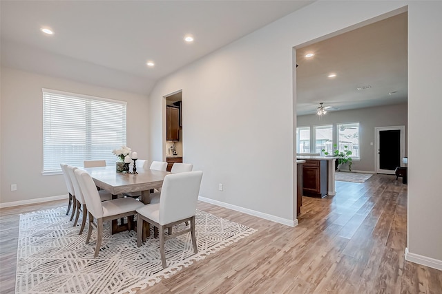 dining room with ceiling fan and light hardwood / wood-style floors