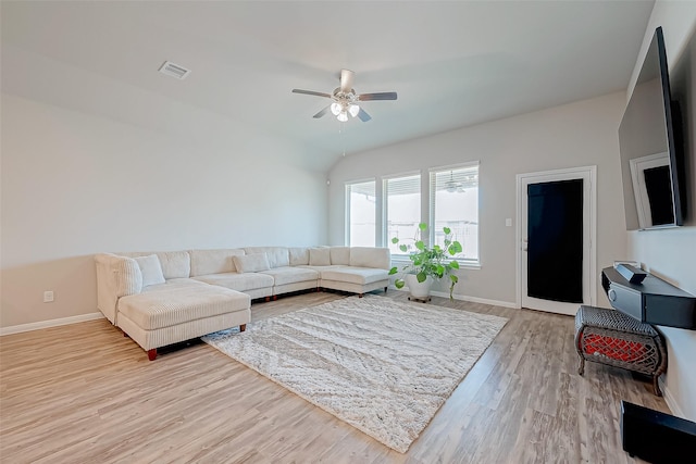 living room with ceiling fan and light hardwood / wood-style flooring