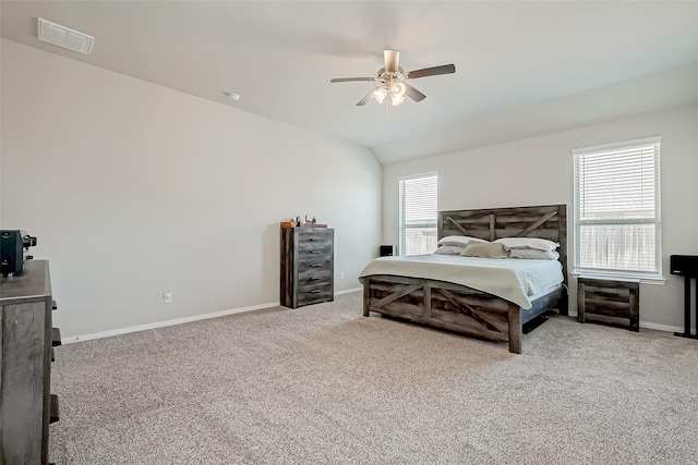 bedroom featuring ceiling fan, carpet floors, and multiple windows