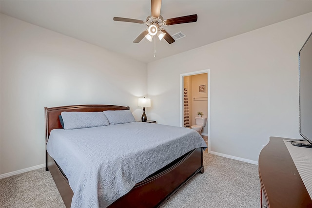 carpeted bedroom featuring ceiling fan and connected bathroom