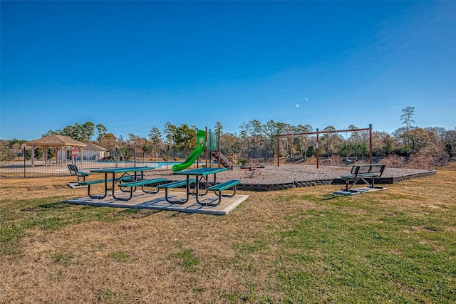 view of playground with a gazebo and a lawn