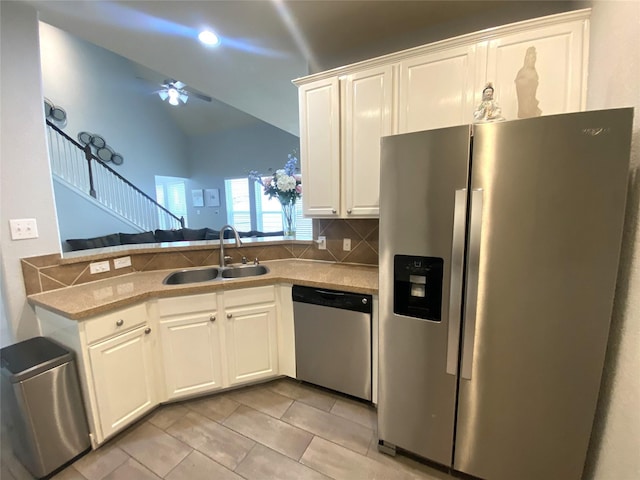 kitchen featuring white cabinetry, sink, decorative backsplash, and appliances with stainless steel finishes