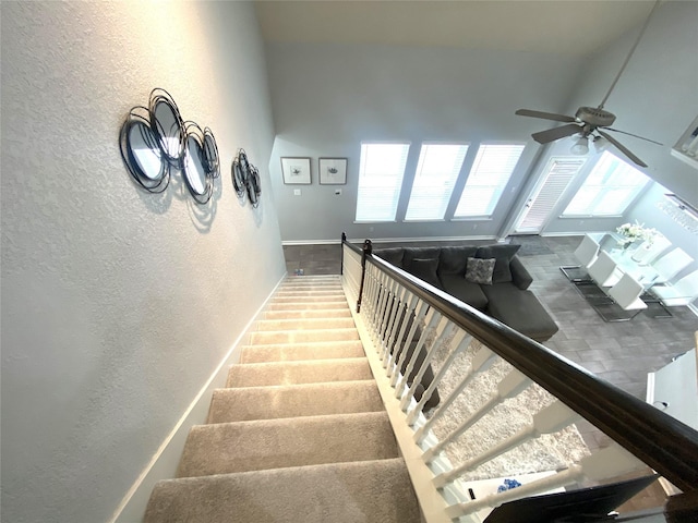 stairs with ceiling fan