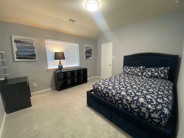 carpeted bedroom featuring vaulted ceiling