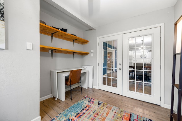 office featuring light hardwood / wood-style flooring and french doors