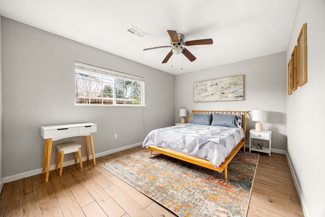 bedroom featuring light hardwood / wood-style flooring and ceiling fan