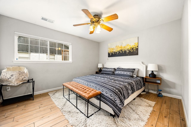 bedroom with ceiling fan and light hardwood / wood-style flooring