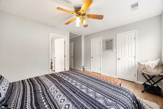 bedroom with ceiling fan and light wood-type flooring