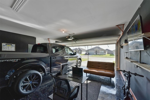 garage featuring a garage door opener