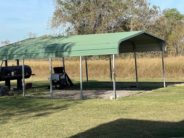 view of parking featuring a lawn and a carport