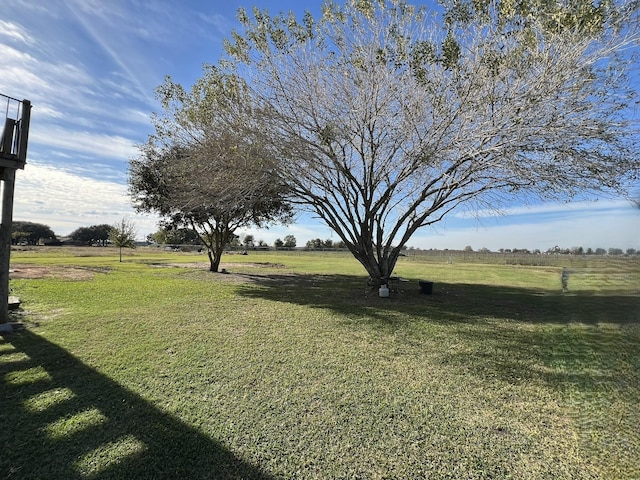 view of yard with a rural view