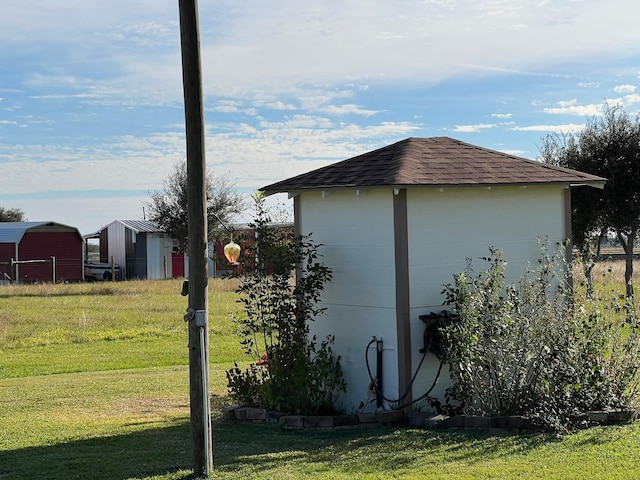 view of property exterior featuring a shed and a lawn