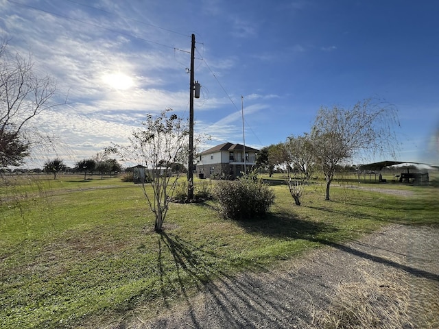 view of yard with a rural view