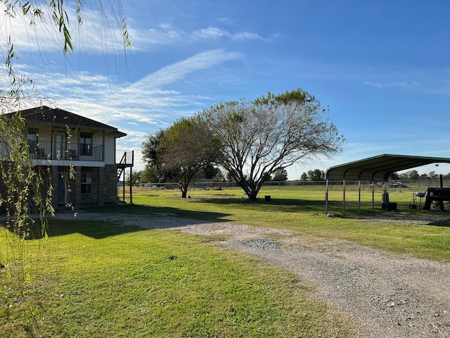 view of yard featuring a carport