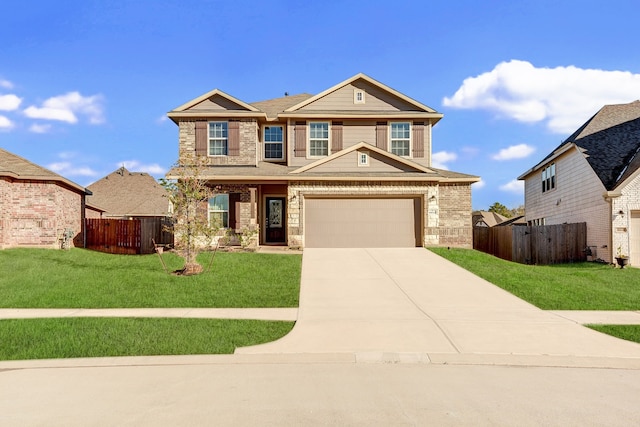 view of front of house featuring a garage and a front lawn