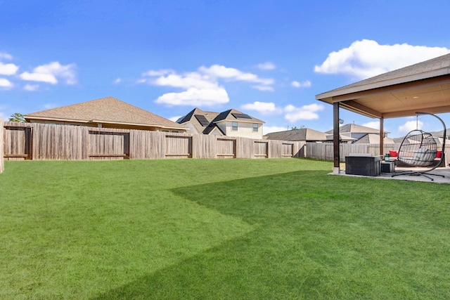 view of yard featuring central AC unit and a patio