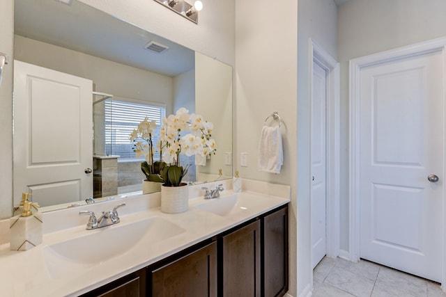 bathroom with tile patterned floors and vanity