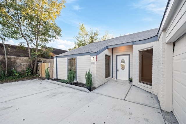 doorway to property featuring a patio area