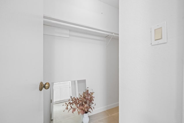 walk in closet featuring light tile patterned floors