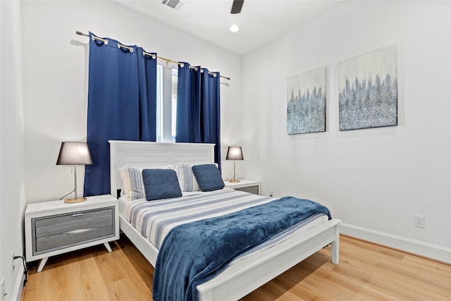 bedroom featuring hardwood / wood-style floors and ceiling fan