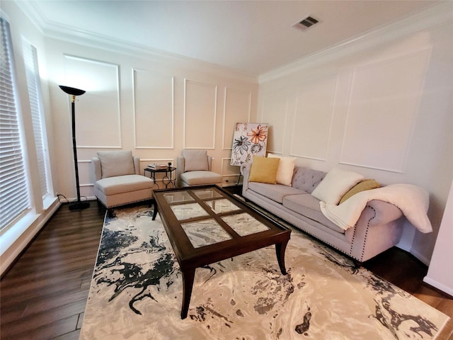 living room featuring ornamental molding and dark hardwood / wood-style floors