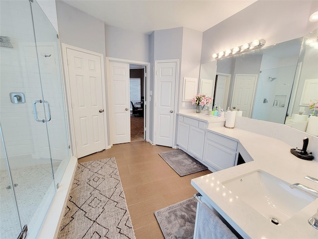 bathroom with vanity and walk in shower