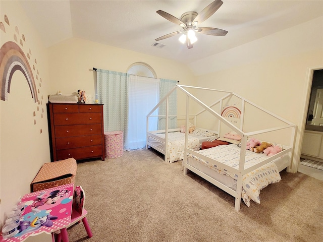 bedroom with vaulted ceiling, light carpet, and ceiling fan