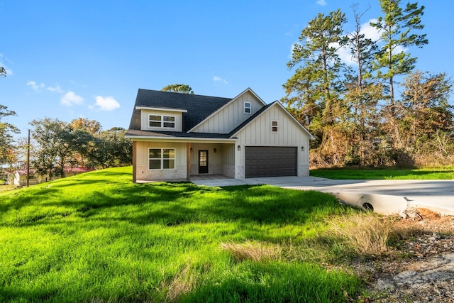 modern farmhouse style home with a garage and a front lawn