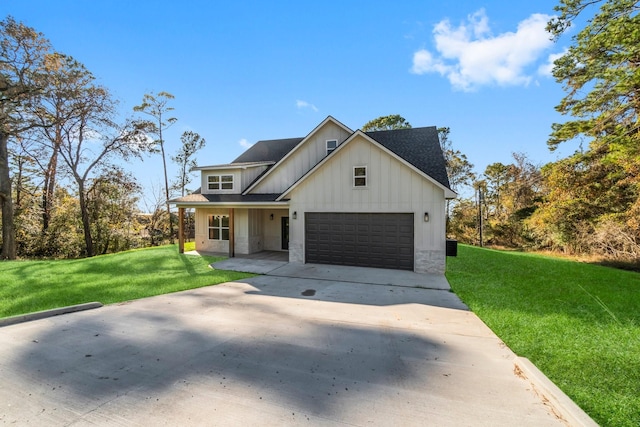 modern farmhouse featuring a garage and a front yard