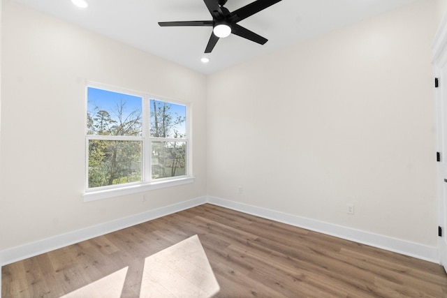 empty room featuring ceiling fan and wood-type flooring