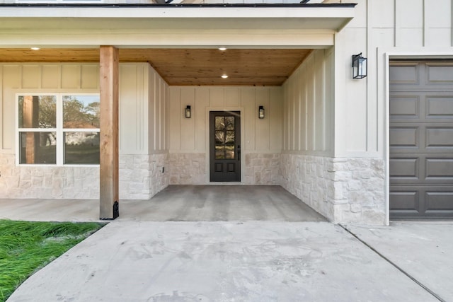 view of exterior entry with a garage