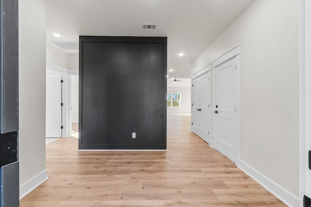 hall with light wood-type flooring