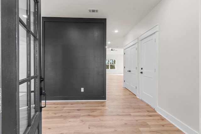 hall featuring light hardwood / wood-style flooring