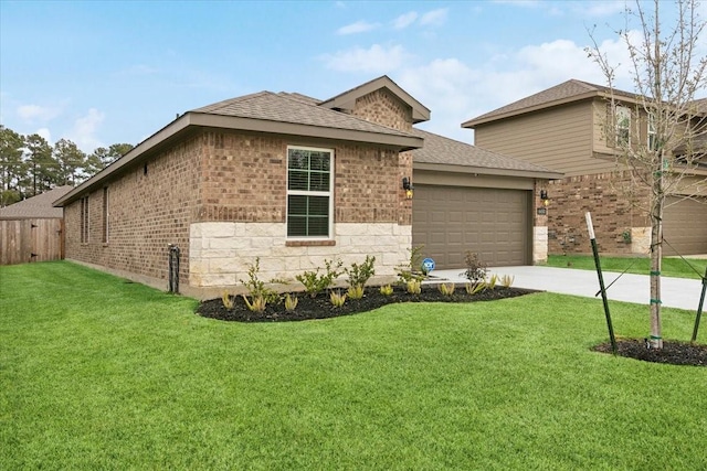 view of front of home featuring a garage and a front yard