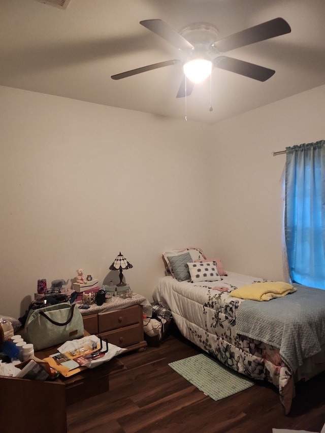 bedroom with hardwood / wood-style flooring and ceiling fan