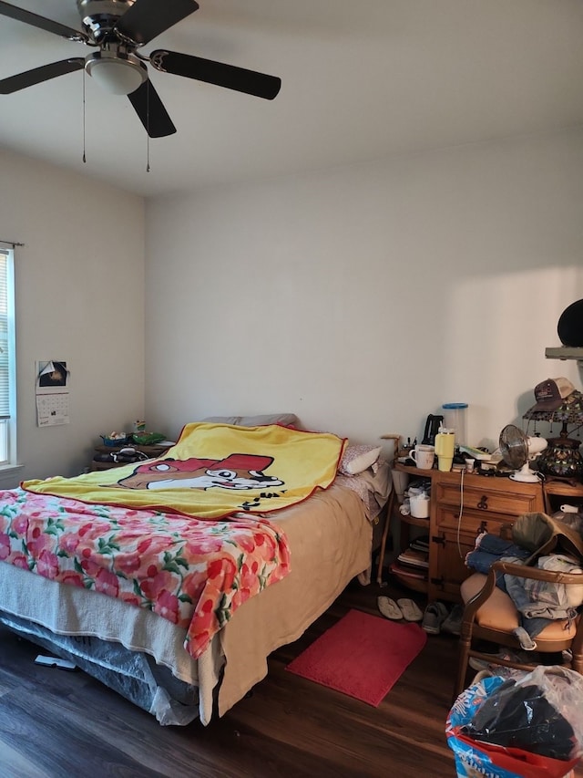 bedroom with ceiling fan and hardwood / wood-style floors