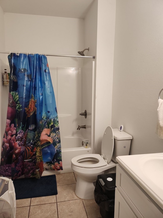 full bathroom with shower / bathtub combination with curtain, vanity, tile patterned floors, and toilet