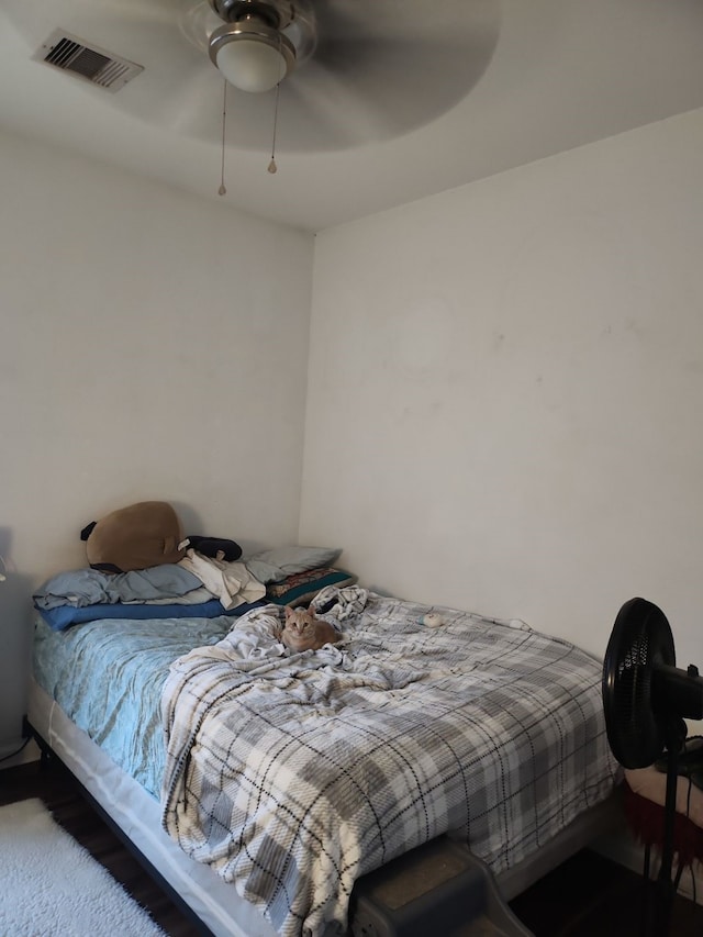 bedroom featuring ceiling fan and carpet