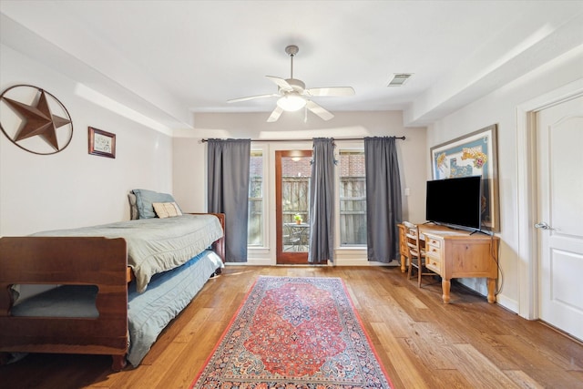 bedroom with ceiling fan and light wood-type flooring